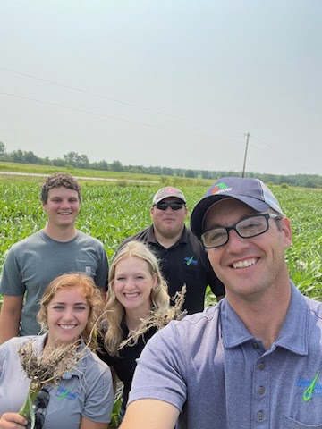 research interns with jake out in the fields doing research